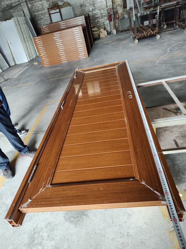 Wood-tone door assembly with a tape measure