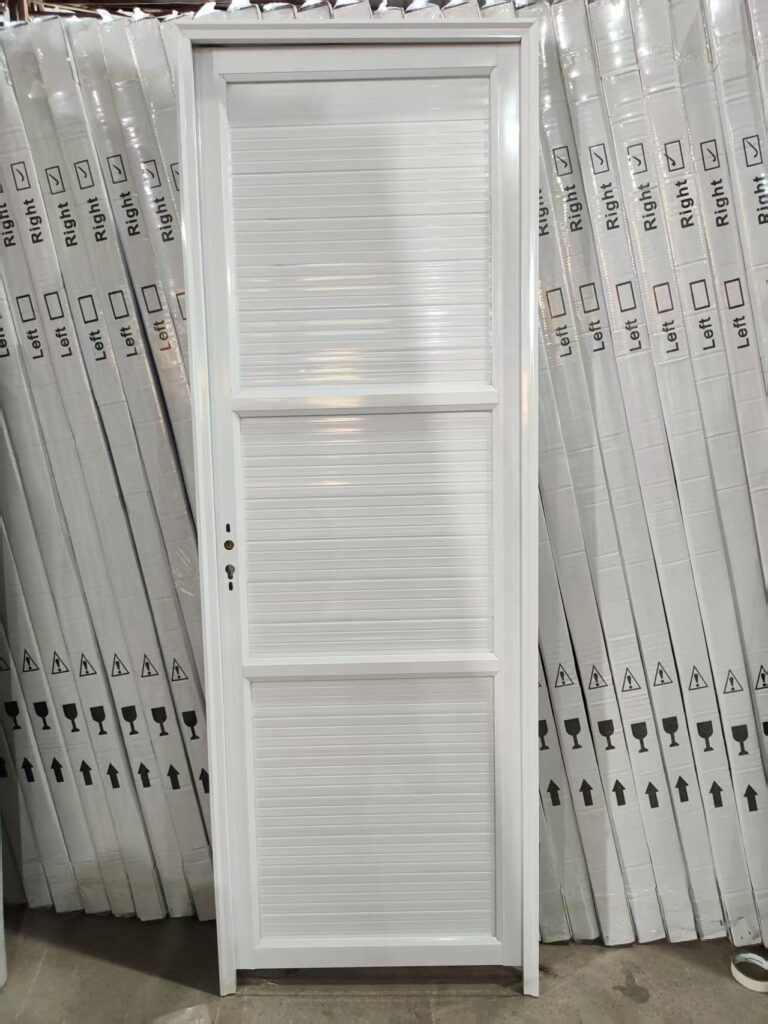 White finished-door sample in the workshop